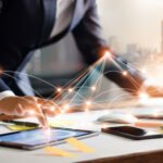 Businessman touching tablet and laptop. Management global structure networking and data exchanges customer connection on workplace. Business technology and digital marketing network concept.